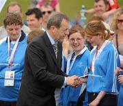 12 June 2010; Former GAA President Sean Kelly, MEP, presents Regina Rattigan, Leinster Region, with her silver medal for women's 5-a-side football during the third day of the 2010 Special Olympics Ireland Games. University of Limerick, Limerick. Picture credit: Stephen McCarthy / SPORTSFILE