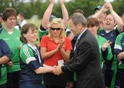 12 June 2010; Former GAA President Sean Kelly, MEP, presents Linda Cannon, from Athenry, Galway, Connacht Region, with her gold medal for women's 5-a-side football during the third day of the 2010 Special Olympics Ireland Games. University of Limerick, Limerick. Picture credit: Stephen McCarthy / SPORTSFILE