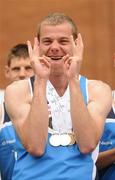 13 June 2010; Edward Kennedy, from Drogheda, Louth, celebrates after picking up his third athletics medal during the final day of the 2010 Special Olympics Ireland Games. University of Limerick, Limerick. Picture credit: Stephen McCarthy / SPORTSFILE