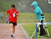 13 June 2010; Elizabeth Walsh, Knocknagree, Kerry, is informed of her position from a judge during the 1500m walk & run athletics event during the final day of the 2010 Special Olympics Ireland Games. University of Limerick, Limerick. Picture credit: Stephen McCarthy / SPORTSFILE