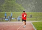 13 June 2010; Elizabeth Walsh, from Knocknagree, Kerry, competes amid a downpour during the 1500m walk & run athletics event during the final day of the 2010 Special Olympics Ireland Games. University of Limerick, Limerick. Picture credit: Stephen McCarthy / SPORTSFILE