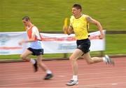 13 June 2010; Keith Skelly, from Drogheda, Co. Louth, Leinster, right, on his way helping his team win the 4x100m Relay Final, division 26, from second place team Eastern Region, Dermot Ryan, from Navan Road, Dublin, left, during the 2010 Special Olympics Ireland Games. University of Limerick, Limerick. Picture credit: Diarmuid Greene / SPORTSFILE