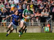 15 May 2016; Niall McNamee of Offaly gets past Dermot Brady and Dessie Reynolds, behind, of Longford during the Leinster GAA Football Senior Championship, Round 1, Offaly v Longford in O'Connor Park, Tullamore, Co. Offaly.  Photo by Piaras O Midheach/Sportsfile