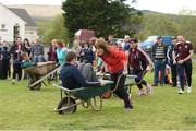 8 May 2016; Eoin O'Leary and Marie O'Connor competing in the wheelbarrow race during the Piarsaigh Na Dromoda Lá na gClubanna celebrations. Lá Na gClubanna - Piarsaigh Na Dromoda. Páirc an Phiarsaigh, Inse na Toinne, Dromid, Co. Kerry. Picture credit: Diarmuid Greene / SPORTSFILE
