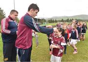 8 May 2016; Kerry minor footballer Graham O'Sullivan presents medals to young members at the Piarsaigh Na Dromoda Lá na gClubanna celebrations. Lá Na gClubanna - Piarsaigh Na Dromoda. Páirc an Phiarsaigh, Inse na Toinne, Dromid, Co. Kerry. Picture credit: Diarmuid Greene / SPORTSFILE