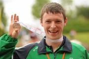 13 June 2010; Connacht Region athlete James Carr, from Athlone, Westmeath, celebrates his silver medal in the relay atheltics event during the final day of the 2010 Special Olympics Ireland Games. University of Limerick, Limerick. Picture credit: Stephen McCarthy / SPORTSFILE