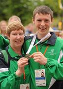 13 June 2010; Connacht Region athlete James Carr, from Athlone, Westmeath, and his chapperone Marion Lynch celebrate his silver medal in the relay atheltics event during the final day of the 2010 Special Olympics Ireland Games. University of Limerick, Limerick. Picture credit: Stephen McCarthy / SPORTSFILE