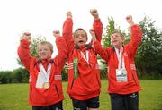 13 June 2010; Bandon, Cork, athletes, from left, Conor O'Dwyer, Ronan Desmond and Liam Buckley celebrate with friends and family after collecting their medals during the final day of the 2010 Special Olympics Ireland Games. University of Limerick, Limerick. Picture credit: Stephen McCarthy / SPORTSFILE