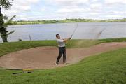 11 June 2010; Michael McEntaggart, from Crossmaglen Rangers GAA club, chips out of the bunker onto the 11th green. FBD All-Ireland GAA Golf Challenge 2010 - Ulster Final, Concra Wood Golf & Country Club, Castleblayney, Co. Monaghan. Picture credit: Oliver McVeigh / SPORTSFILE
