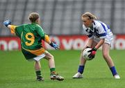 13 June 2010; Lisa Daly, Laois, in action against Lauren McLoughlin, Meath, during the half-time Go Games. Leinster GAA Football Senior Championship Quarter-Final, Meath v Laois, Croke Park, Dublin. Picture credit: Brian Lawless / SPORTSFILE