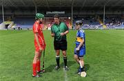 12 June 2010; Referee Fintan McNamara performs the coin toss between captains Orla Cotter, Cork, and Jill Horan, Tipperary. Gala All-Ireland Senior Camogie Championship, Tipperary v Cork, Semple Stadium, Thurles, Co. Tipperary. Picture credit: Brendan Moran / SPORTSFILE