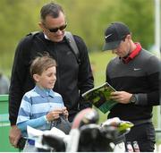 17 May 2016; Rory McIlroy with golf fan Sean Reddy, age 9, from Ballyvolane, Co. Cork, at the practice day prior to the Dubai Duty Free Irish Open Golf Championship at The K Club in Straffan, Co. Kildare. Photo by Matt Browne/Sportsfile