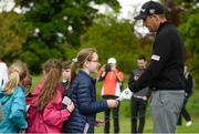 18 May 2016; Padraig Harrington signs autographs for 4th and 5th class students from Scoil Bhride, Straffan, Co. Kildare, during his round at the Dubai Duty Free Irish Open Golf Championship Pro-Am at The K Club in Straffan, Co. Kildare. Photo by Diarmuid Greene/Sportsfile