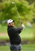 18 May 2016; Shane Lowry watches his second shot on the 11th fairway during the Dubai Duty Free Irish Open Golf Championship Pro-Am at The K Club in Straffan, Co. Kildare. Photo by Diarmuid Greene/Sportsfile