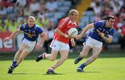 23 May 2010; J.P. Rooney, Louth, in action against Dermot Brady, left, and Diarmuid Masterson, Longford. Leinster GAA Football Senior Championship Preliminary Round, Louth v Longford, O'Moore Park, Portlaoise, Co. Laois. Picture credit: Brian Lawless / SPORTSFILE