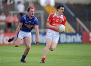 23 May 2010; Adrian Reid, Louth, in action against Peter Foy, Longford. Leinster GAA Football Senior Championship Preliminary Round, Louth v Longford, O'Moore Park, Portlaoise, Co. Laois. Picture credit: Brian Lawless / SPORTSFILE