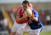 23 May 2010; Shane Lennon, Louth, in action against Noel Farrell, Longford. Leinster GAA Football Senior Championship Preliminary Round, Louth v Longford, O'Moore Park, Portlaoise, Co. Laois. Picture credit: Brian Lawless / SPORTSFILE