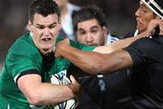 18 June 2010; Ireland's Jonathan Sexton is challenged by New Zealand Maori's Tanerau Latimer. Summer Tour 2010, New Zealand Maori v Ireland, International Stadium, Rotorua, New Zealand. Picture credit: David Rowland / SPORTSFILE