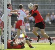 19 June 2010; Harry Og Conlon and Thomas Canavan, Tyrone, save the ball off the line despite the efforts of Caolan Mooney, Down. Tyrone v Down - Ulster GAA Football Minor Championship Quarter-Finall, Tyrone v Down, Casement Park, Belfast, Co. Antrim. Picture credit: Oliver McVeigh / SPORTSFILE