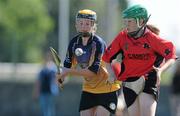 20 June 2010; Lorraine Canny, Killanena, Co. Clare, left, in action against Alanna Maunsell, Cillard, Co. Kerry, Division 4 Camogie Final. Coca-Cola GAA Féile na nGael Finals 2010. Clarecastle, Co. Clare. Picture credit: Diarmuid Greene / SPORTSFILE