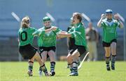 20 June 2010; Lucan Sarsfields, Dublin, players from left to right, Amber O'Connor, Anne Marie Courtney and Aoife Flynn celebrate at the final whistle after victory over Burgess-Duharra, Tipperary. Division 1 Camogie Final. Coca-Cola GAA Féile na nGael Finals 2010. Cusack Park, Ennis, Co. Clare. Picture credit: Diarmuid Greene / SPORTSFILE