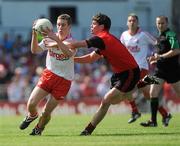 19 June 2010; Niall Sludden, Tyrone, in action against  Niall Madine, Down. Ulster GAA Football Minor Championship Semi-Final, Tyrone v Down, Casement Park, Belfast, Co. Antrim. Picture credit: Oliver McVeigh / SPORTSFILE