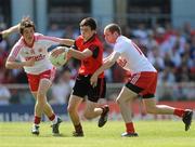 19 June 2010; Denis Murtagh, Down, in action against Ronan O'Neill and Enda McGahan, Tyrone. Ulster GAA Football Minor Championship Semi-Final, Tyrone v Down, Casement Park, Belfast, Co. Antrim. Picture credit: Oliver McVeigh / SPORTSFILE