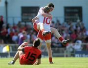 19 June 2010; Conor Clarke and Richard Donnelly, Tyrone, celebrate at the end of the game as Rya O'Hare, Down, looks on. Ulster GAA Football Minor Championship Semi-Final, Tyrone v Down, Casement Park, Belfast, Co. Antrim. Picture credit: Oliver McVeigh / SPORTSFILE