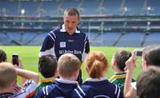 22 June 2010; Ulster Bank GAA star Kieran Donaghy, of Kerry, takes questions and has his photo taken while welcoming pupils from schools to Croke Park as part of the Ulster Bank/Irish News competition where five lucky classes won a school trip of a lifetime which included a tour of the famous Croke Park Stadium while also meeting some of the biggest GAA stars in the country. Croke Park, Dublin. Picture credit: Brendan Moran / SPORTSFILE