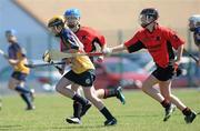 20 June 2010; Lorraine Canny, Killanena, Co. Clare, in action against Aine O'Connor, and Orla Young, right, Cillard, Co. Kerry, Division 4 Camogie Final. Coca-Cola GAA Féile na nGael Finals 2010. Clarecastle, Co. Clare. Picture credit: Diarmuid Greene / SPORTSFILE