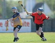 20 June 2010; Michelle Connors, Killanena, Co. Clare, in action against Marianne Nolan, Cillard, Co. Kerry, Division 4 Camogie Final. Coca-Cola GAA Féile na nGael Finals 2010. Clarecastle, Co. Clare. Picture credit: Diarmuid Greene / SPORTSFILE