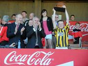 20 June 2010; Castletown-Geoghegan captain Alan Kincaid lifts the Michael Cusack Trophy, in the company of Uachtarán Chumann Lúthchleas Gael Criostóir Ó Cuana and John Coffey, Coca Cola promotions manager, left, after victory over Ruan, Co. Clare, Division 3 Hurling Final. Coca-Cola GAA Féile na nGael Finals 2010. Cusack Park, Ennis, Co. Clare. Picture credit: Diarmuid Greene / SPORTSFILE