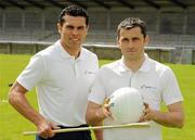 23 June 2010; Cork hurler Seán Óg Ó hAilpín, left, and Dublin footballer Alan Brogan go head to head for the Suremen Challenge. The Suremen Challenge puts local hurling and football team skills to the test and offers them the chance to outwit two of the finest players in the game. Parnell Park, Dublin. Picture credit: David Maher / SPORTSFILE