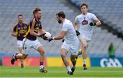 21 May 2016; PJ Banville of Wexford in action against Fergal Conway and Kevin Feely, behind, of Kildare in the Leinster GAA Football Senior Championship, Quarter-Final, Wexford v Kildare, at Croke Park, Dublin. Photo by Piaras Ó Mídheach/Sportsfile
