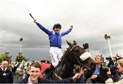 21 May 2016; Jockey Chris Hayes celebrates aboard Awtaad after winning the Tattersalls Irish 2,000 Guineas at the Curragh Racecourse, Curragh, Co. Kildare. Photo by Sportsfile