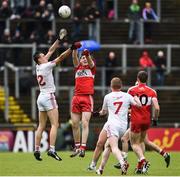 22 May 2016; Paul Donaghy of Tyrone in action against Padraig McGrogan of Derry during the Electric Ireland Ulster GAA Football Minor Championship, Quarter-Final, at Celtic Park, Derry.  Photo by Oliver McVeigh/Sportsfile