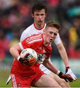 22 May 2016;Eoghan Bradley of Derry in action against Cahir Goodwin of Tyrone during the Electric Ireland Ulster GAA Football Minor Championship, Quarter-Final, at Celtic Park, Derry. Photo by Philip Fitzpatrick/Sportsfile