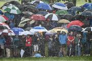 22 May 2016; Spectators shelter from hailstones by the 9th green during the final round of the Dubai Duty Free Irish Open Golf Championship at The K Club in Straffan, Co. Kildare. Photo by Diarmuid Greene/Sportsfile