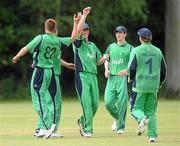 23 June 2010; Phil Eagleston, Ireland, left, congratulates John Mooney after making a catch. RSA Challenge, Ireland v West Indies, Stormont, Belfast, Co. Antrim. Picture credit: Oliver McVeigh / SPORTSFILE