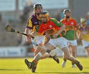 23 June 2010; Killian McCabe, Carlow, in action against Liam Og McGovern, Wexford. Bord Gais Energy Leinster GAA Hurling Under 21 Championship Semi-Final, Wexford v Carlow, Wexford Park, Wexford. Picture credit: Barry Cregg / SPORTSFILE