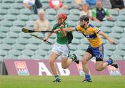 25 June 2010; Mike Fitzgibbon, Limerick, in action against Stephen O'Halloran, Clare. ESB Munster GAA Hurling Minor Championship Semi-Final, Limerick v Clare, Gaelic Grounds, Limerick. Picture credit: Diarmuid Greene / SPORTSFILE