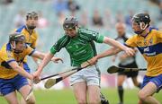 25 June 2010; Declan Hannon, Limerick, holds off the challenge of Enda Boyce, left, and Cathal Malone, Clare. ESB Munster GAA Hurling Minor Championship Semi-Final, Limerick v Clare, Gaelic Grounds, Limerick. Picture credit: Diarmuid Greene / SPORTSFILE