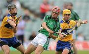 25 June 2010; Mike Fitzgibbon, Limerick, in action against Stephen O'Halloran, left, and Colm Galvin, Clare. ESB Munster GAA Hurling Minor Championship Semi-Final, Limerick v Clare, Gaelic Grounds, Limerick. Picture credit: Diarmuid Greene / SPORTSFILE
