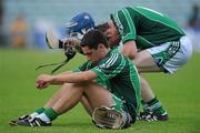 25 June 2010; Dejected Limerick players John Fitzgibbon, left, and Brendan O'Connor at the final whistle. ESB Munster GAA Hurling Minor Championship Semi-Final, Limerick v Clare, Gaelic Grounds, Limerick. Picture credit: Diarmuid Greene / SPORTSFILE