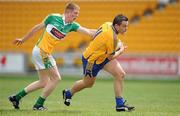 26 June 2010; Peter O'Dwyer, Clare, in action against Brian Geraghty, Offaly. GAA Football All-Ireland Senior Championship Qualifier Round 1, Offaly v Clare, O'Connor Park, Tullamore, Co. Offaly. Picture credit: Brendan Moran / SPORTSFILE