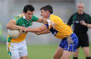 26 June 2010; John Reynolds, Offaly, in action against Gordon Kelly, Clare. GAA Football All-Ireland Senior Championship Qualifier Round 1, Offaly v Clare, O'Connor Park, Tullamore, Co. Offaly. Picture credit: Brendan Moran / SPORTSFILE