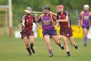 26 June 2010; Michelle O'Leary, Wexford, in action against Orla Kilkenny, left, and Therese Maher, Galway. Gala All-Ireland Senior Camogie Championship, Galway v Wexford. Kenny Park, Athenry, Co Galway. Picture credit: Diarmuid Greene / SPORTSFILE