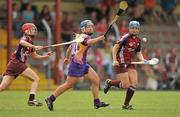 26 June 2010; Katriona Parrock, Wexford, in action against Therese Maher, left, and Emma Kilkelly, Galway. Gala All-Ireland Senior Camogie Championship, Galway v Wexford. Kenny Park, Athenry, Co Galway. Picture credit: Diarmuid Greene / SPORTSFILE