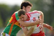 26 June 2010; Enda Muldoon, Derry, in action against Shane Redmond, Carlow. GAA Football All-Ireland Senior Championship Qualifier Round 1, Carlow v Derry, Dr. Cullen Park, Carlow. Photo by Sportsfile