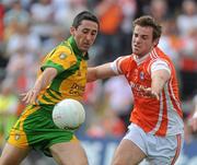 26 June 2010; Rory Kavanagh, Donegal, in action against Kevin Dyas, Armagh. GAA Football All-Ireland Senior Championship Qualifier Round 1, Armagh v Donegal, Crossmaglen, Co. Armagh. Picture credit: Oliver McVeigh / SPORTSFILE